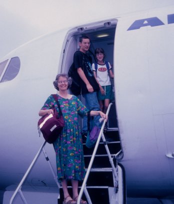 family boarding the plane
