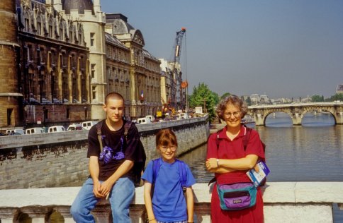 family on bridge over the Seine