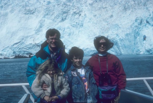 family in front of a glacier